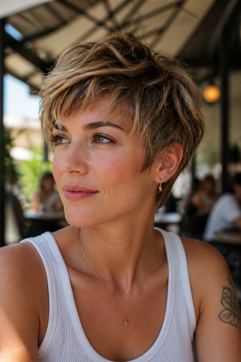 Close-up of a woman with a textured pixie shag.