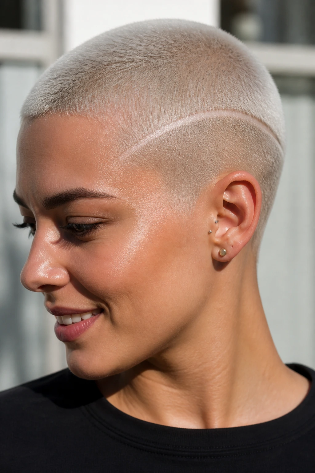 Close-up of platinum buzz cut with shaved line detailing.