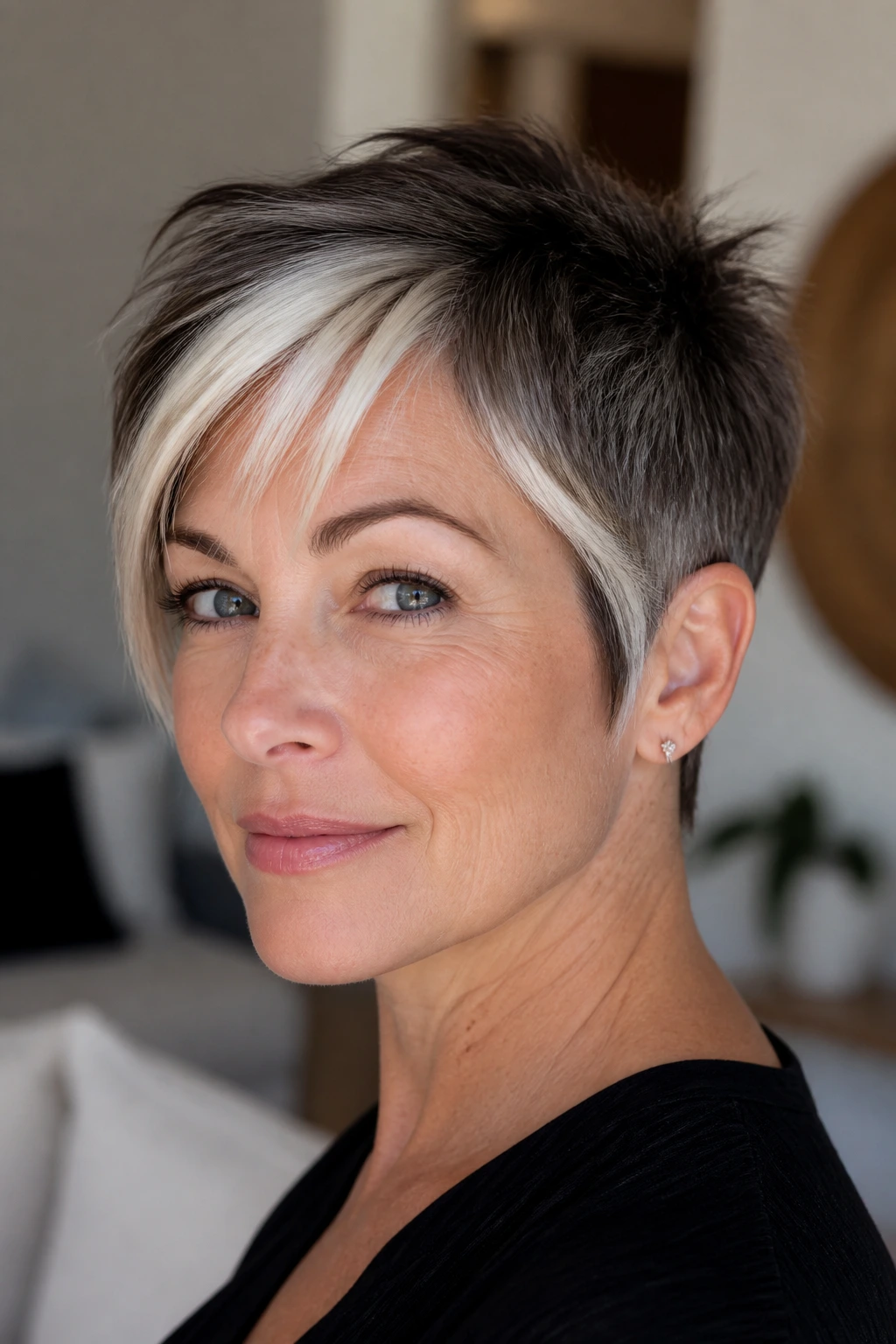 Pixie cut with icy platinum face-framing pieces at fringe and temple