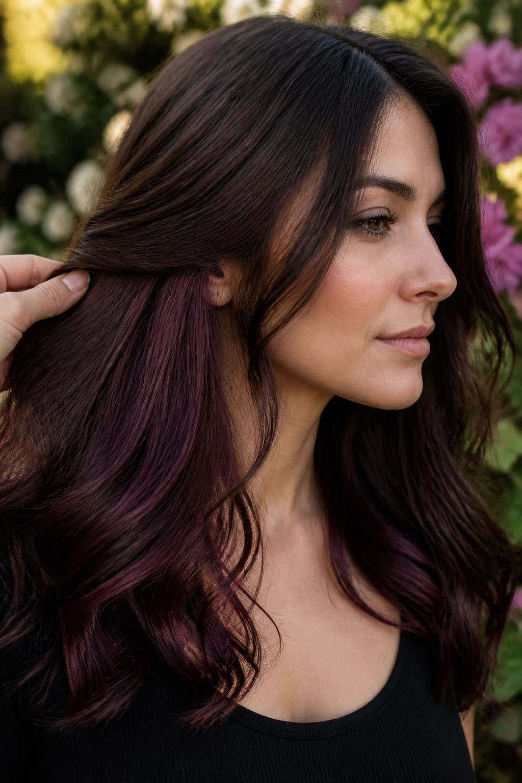 Close-up of a real woman with plum-shadow chocolate brown showing violet-brown underlight