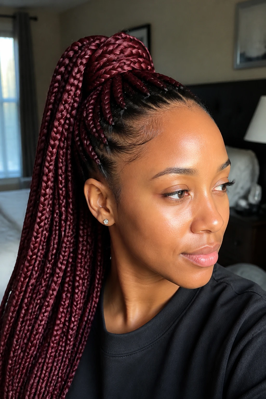 Close-up of a real woman with a red wine high braided ponytail