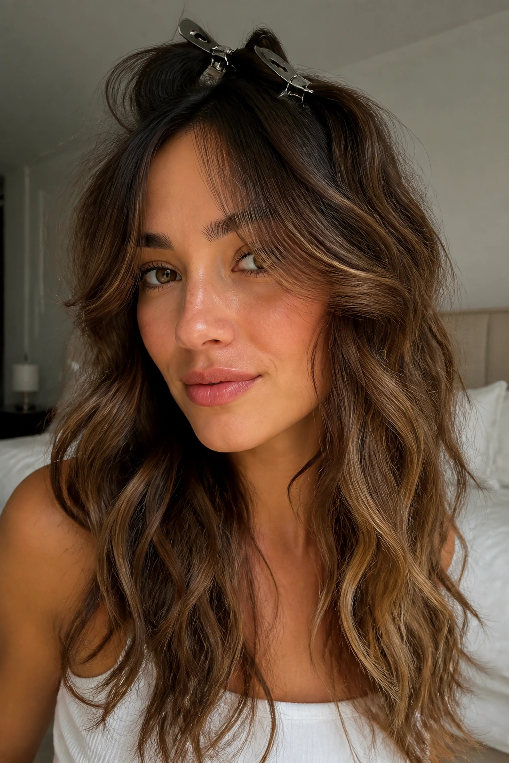 Portrait showing fringe pinned at root for lift in waves