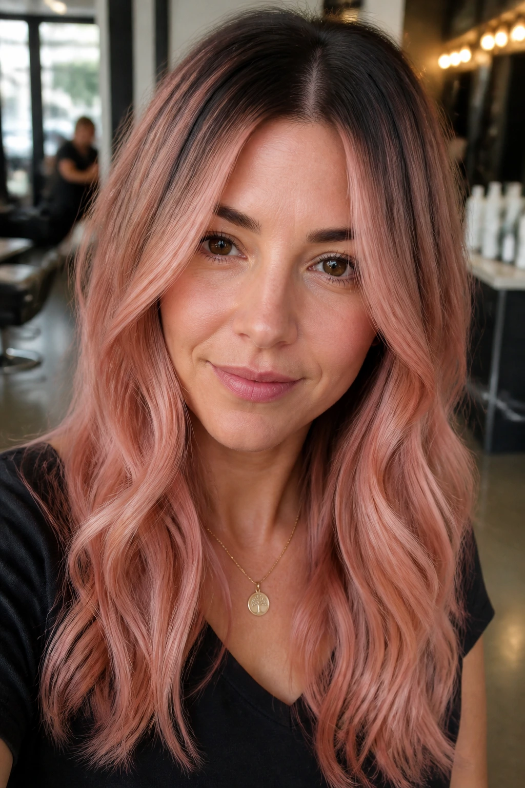 Real woman showing rooted blush ombré with shadow root