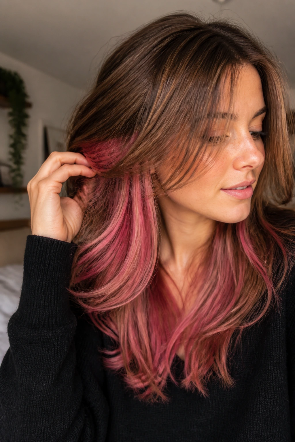 Close-up portrait of a real woman with rosy pink underlayers peeking through layers.