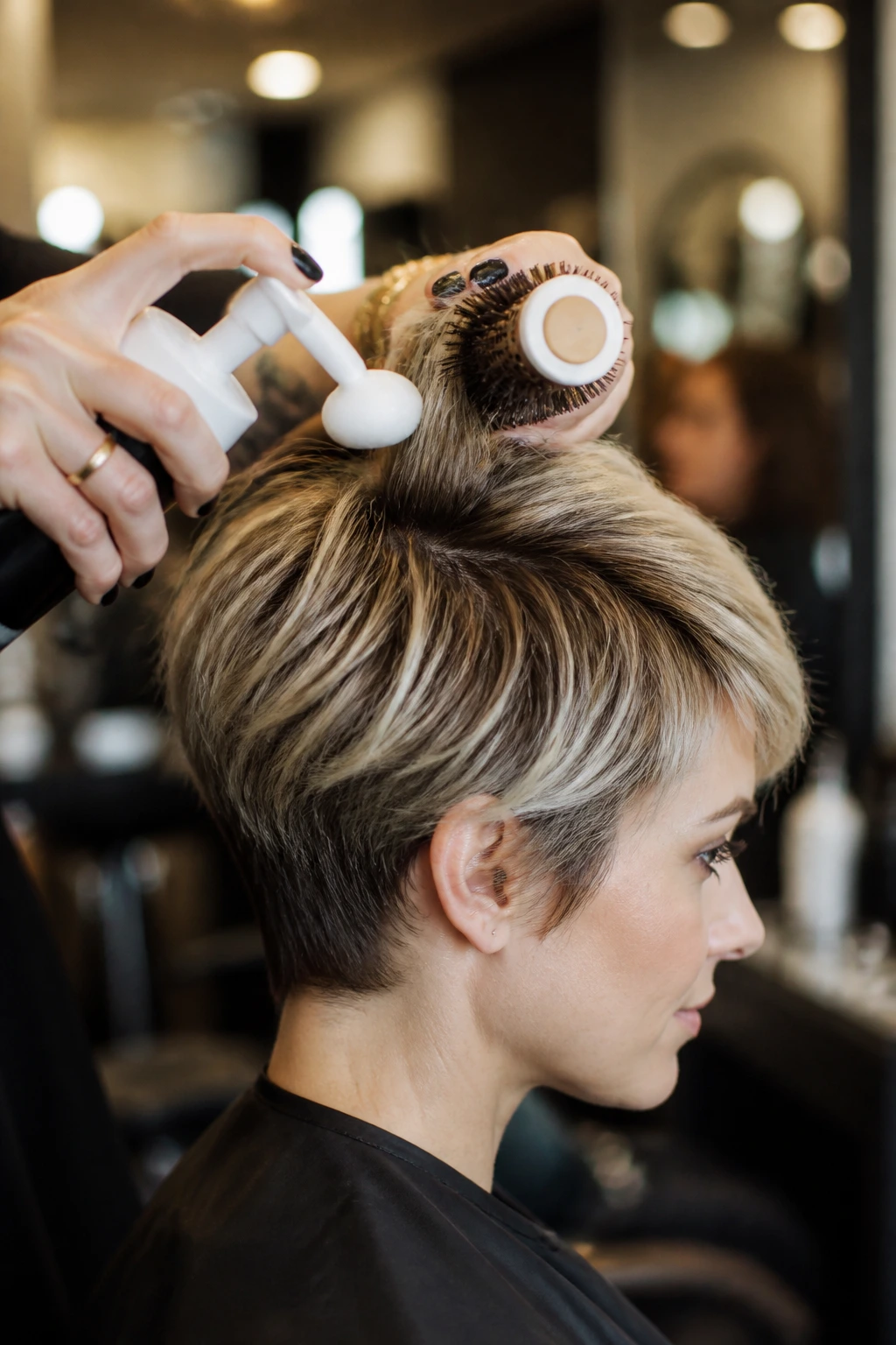 Close-up of salon tools and product used on short hair.