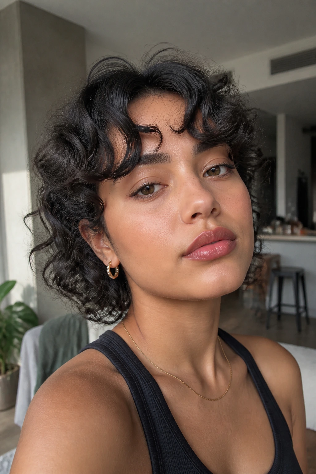 Woman with S-curve bangs showing curved fringe and natural lighting
