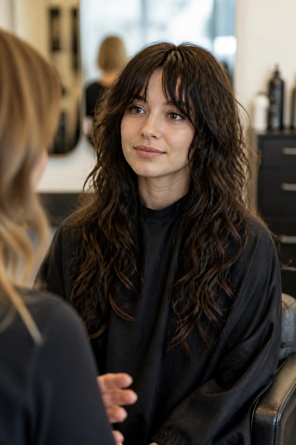 Portrait of a person in a salon chair with a long wolf cut