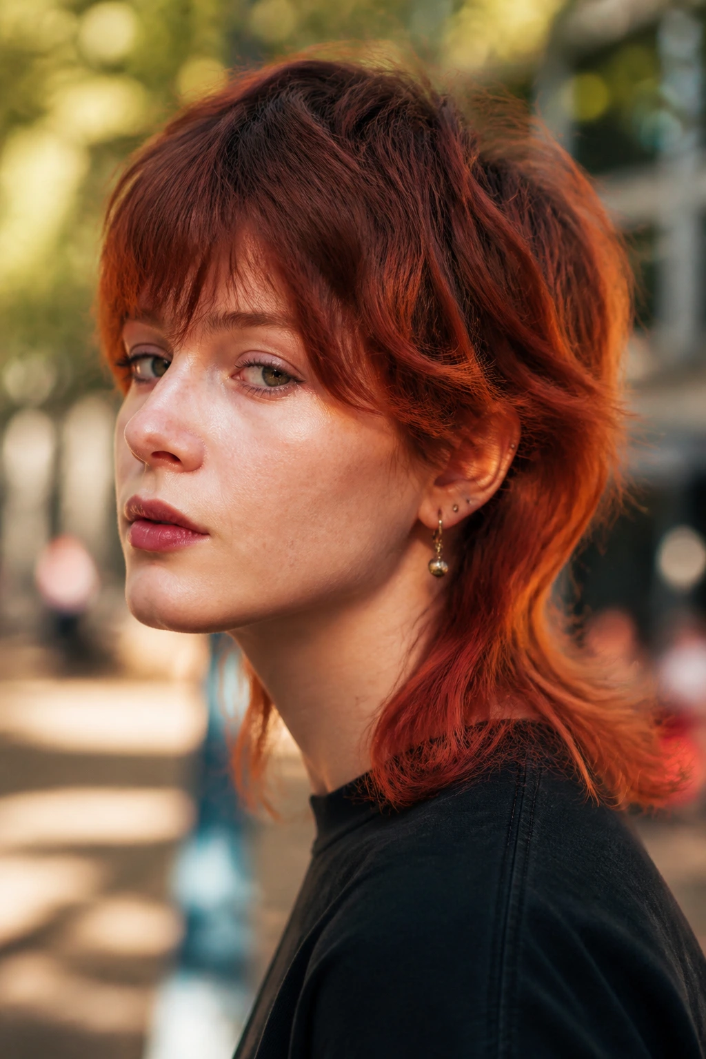 Close-up portrait of real person with shadow-root auburn mullet.