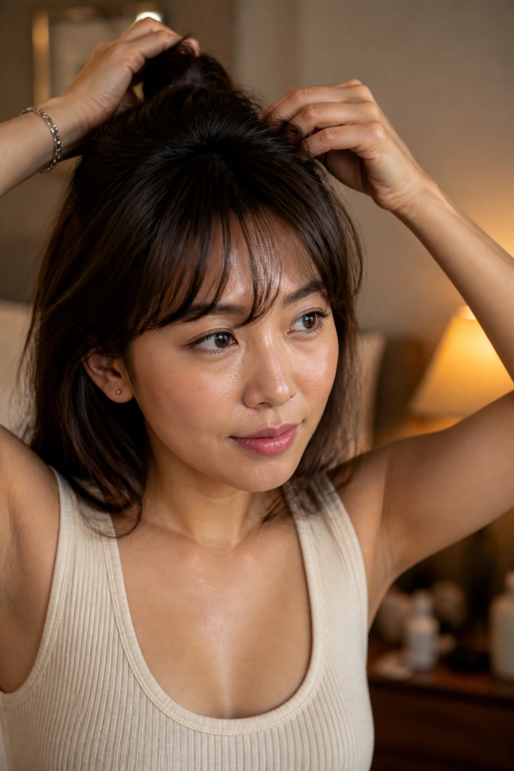 Close-up of a real person lifting bangs at the crown for shape