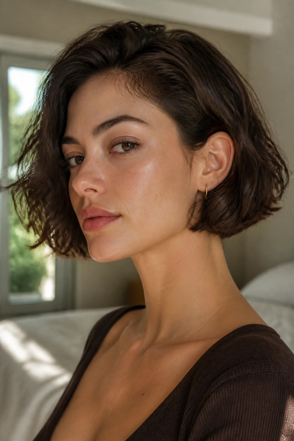 Close-up of a real person with a short Italian bob tucked behind the ear
