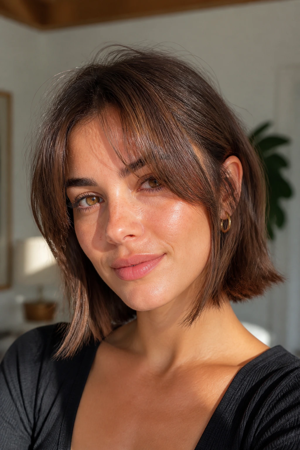 Real person with short lob and face-framing bangs.