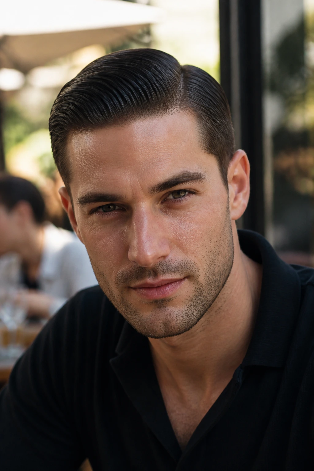 Close-up portrait of a man with a subtle side-part slick back hairstyle in an outdoor cafe setting
