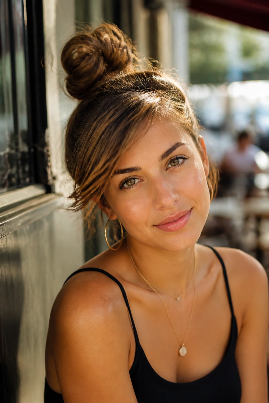 Close-up of a real woman with a side-swept top knot