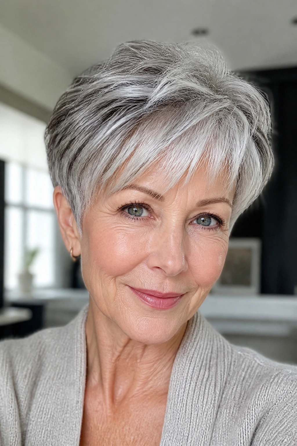 Close-up of an older woman showing soft gray blending in short silver hair
