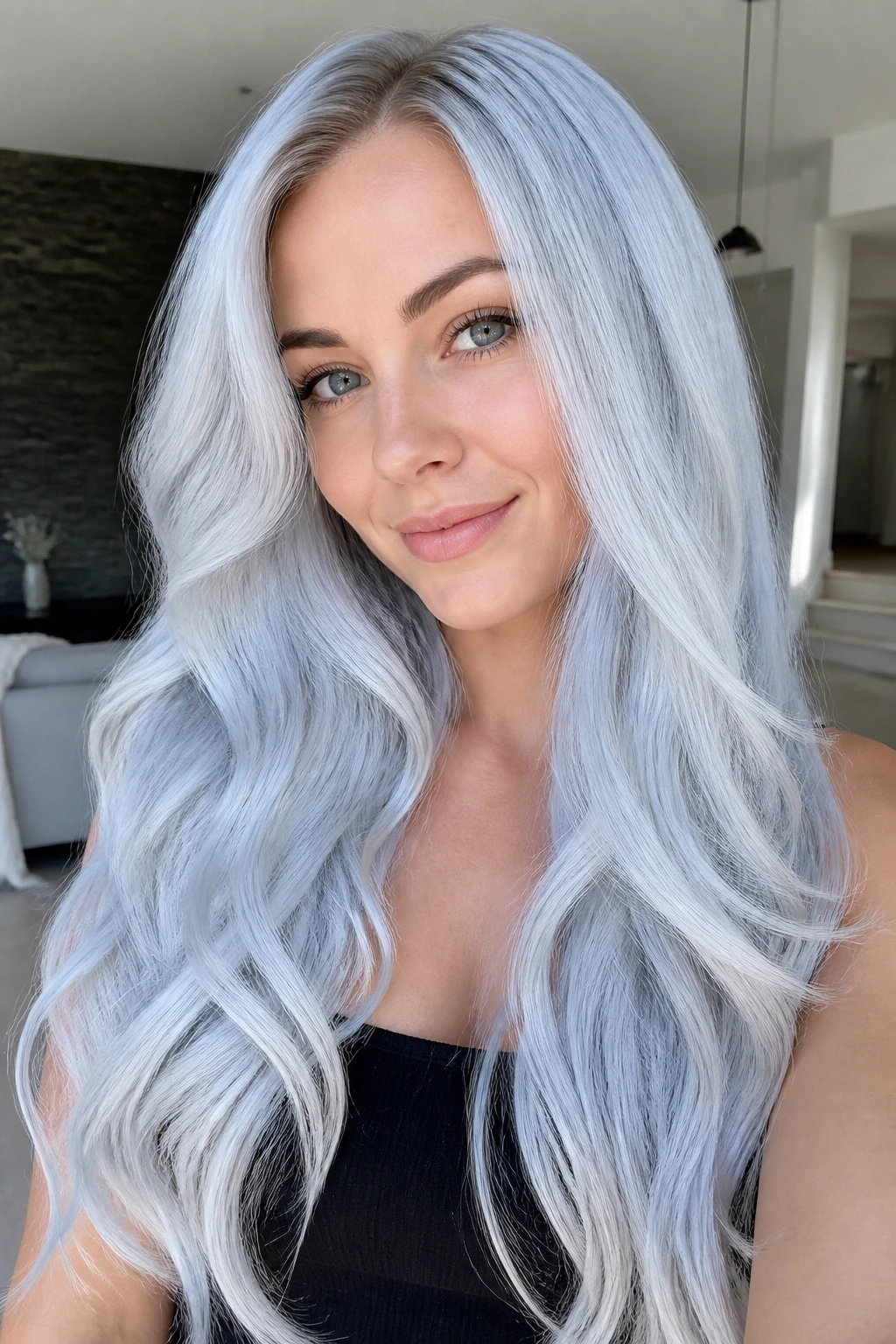 Close-up of silver tide white blonde hair with a cool blue cast on a real person.