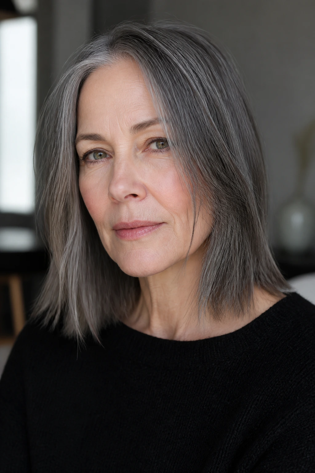 Close-up of a real person with slate gray lob and razor-ended ends.