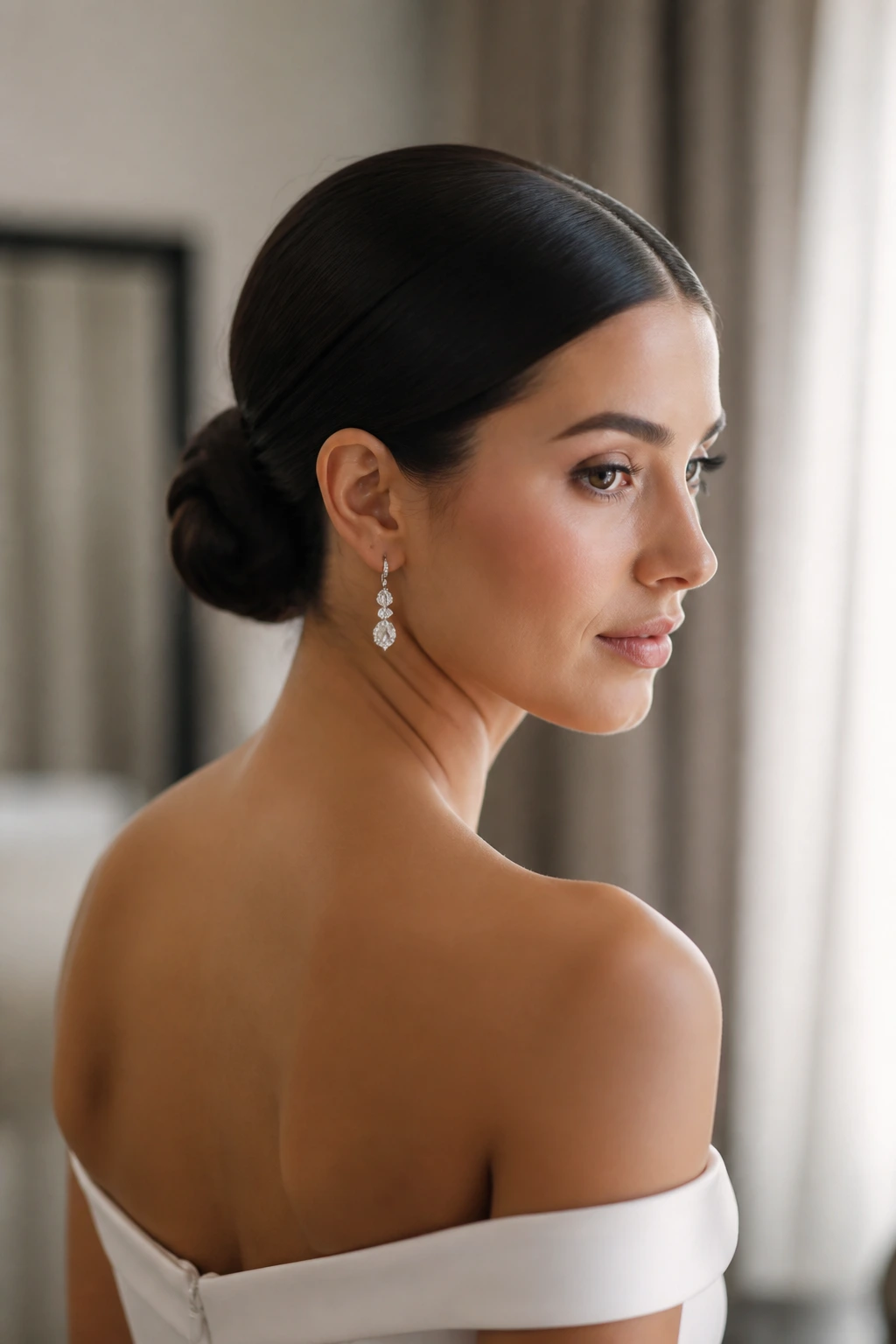 Bride with sleek middle-part low bun close-up