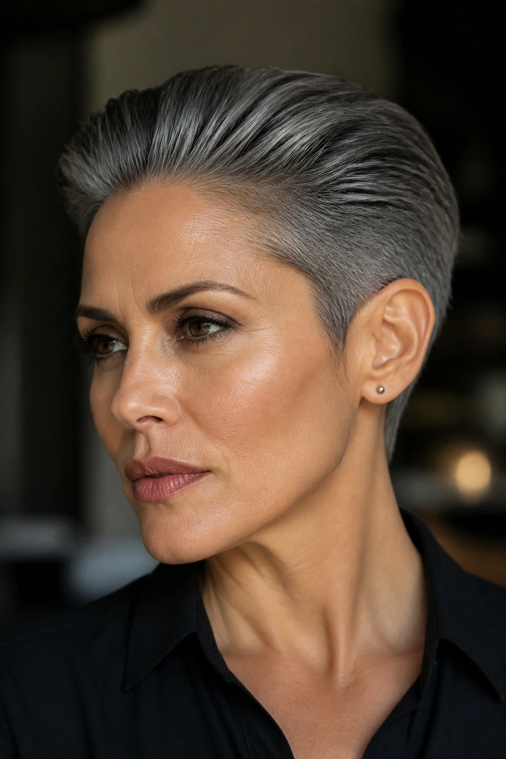 Close-up of a real person with a graphite slicked-back crop