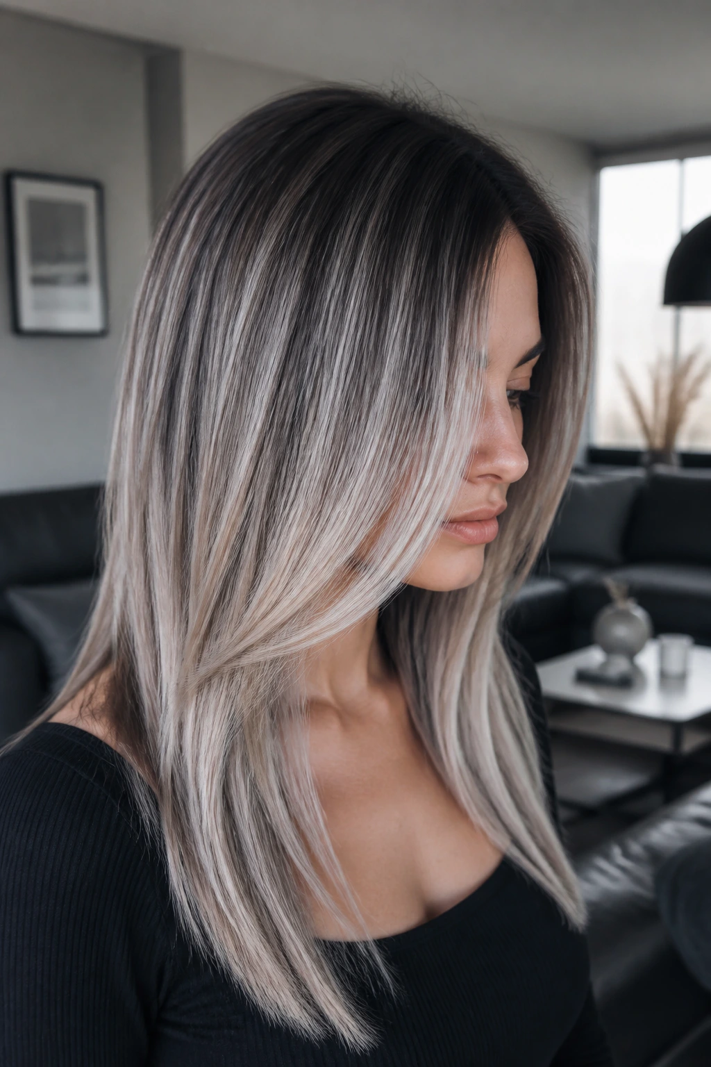 Close-up portrait with ash-silver balayage in cool lighting