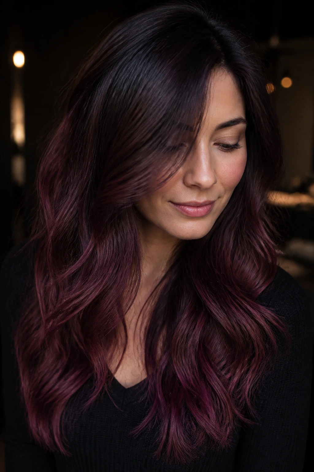 Close-up of smoky plum melt on brunette hair with muted plum and dusty berry ends