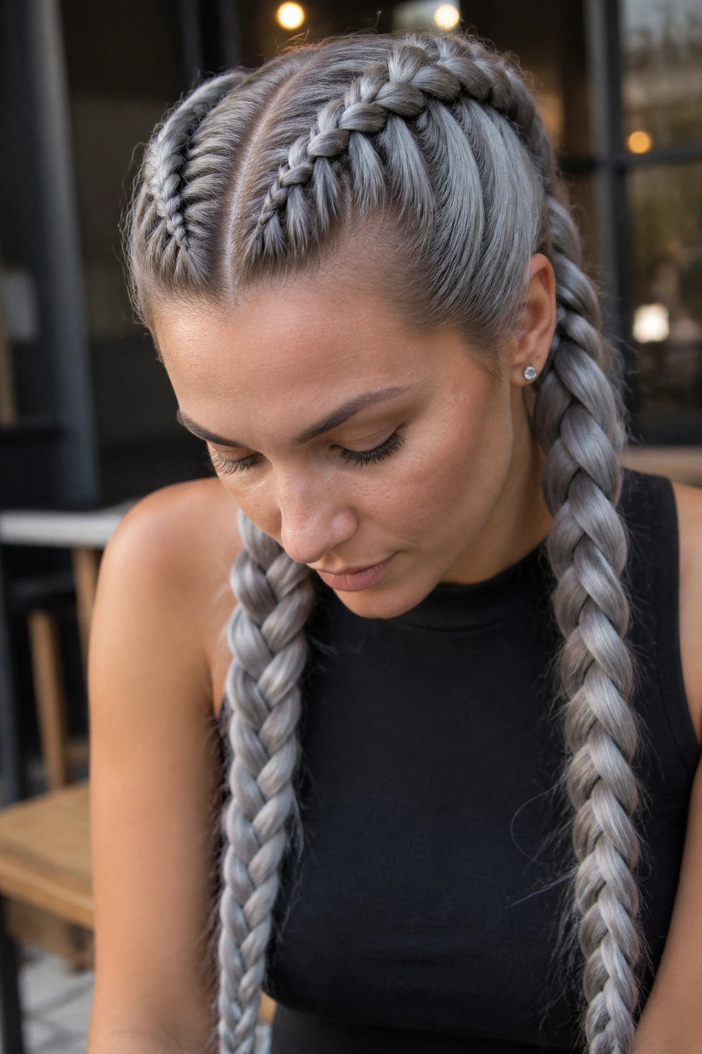 Close-up portrait of a real woman with smoky silver Dutch braids