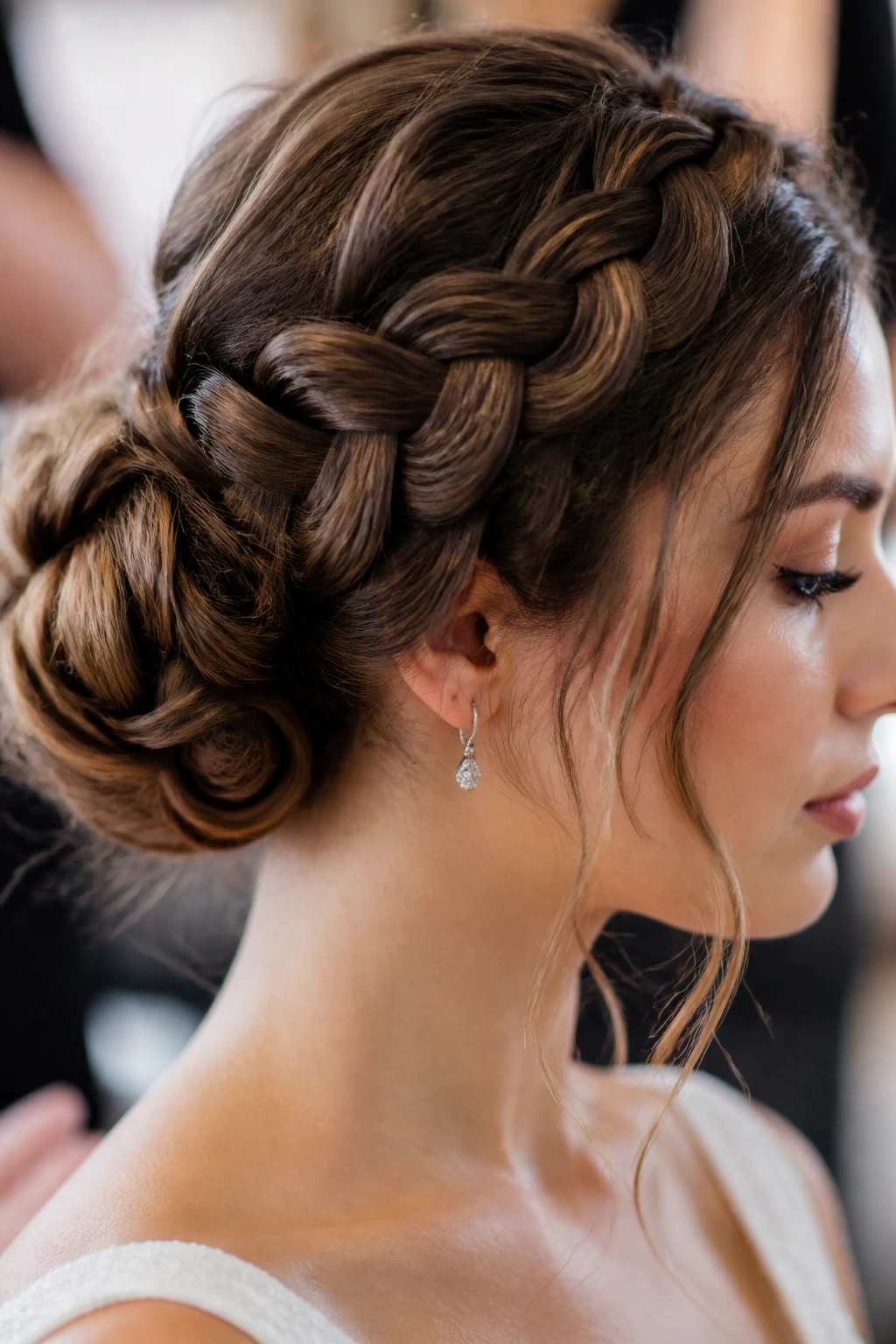 Close-up of a real woman with a soft braided bun at the back of head
