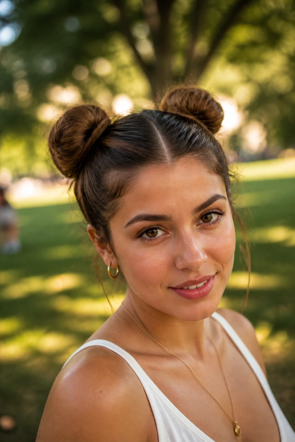 Close-up of a real woman with space buns and a center part