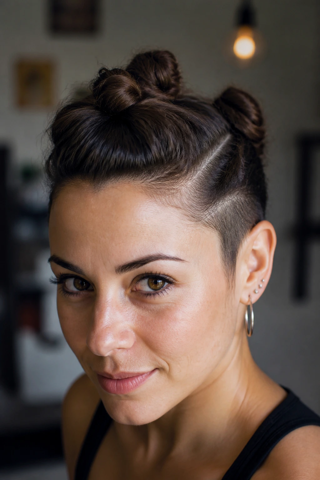 Close-up of a real woman with space buns faux hawk hairstyle