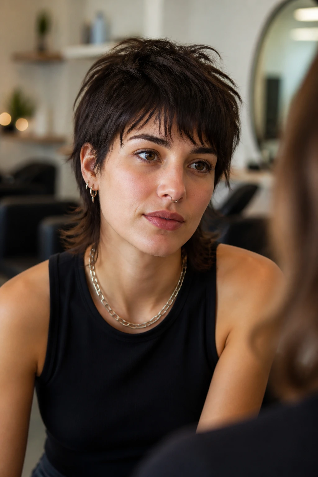 Real woman with short wolf cut in a salon-like setting