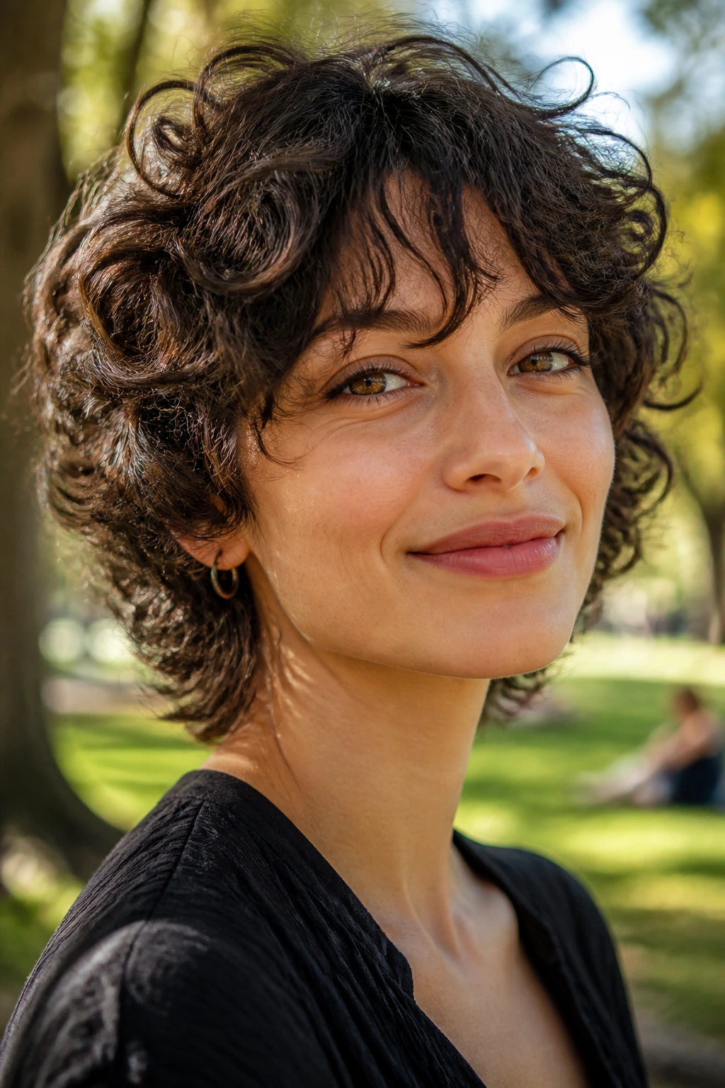 Portrait of a person with tapered shag and wispy bangs in an outdoor park