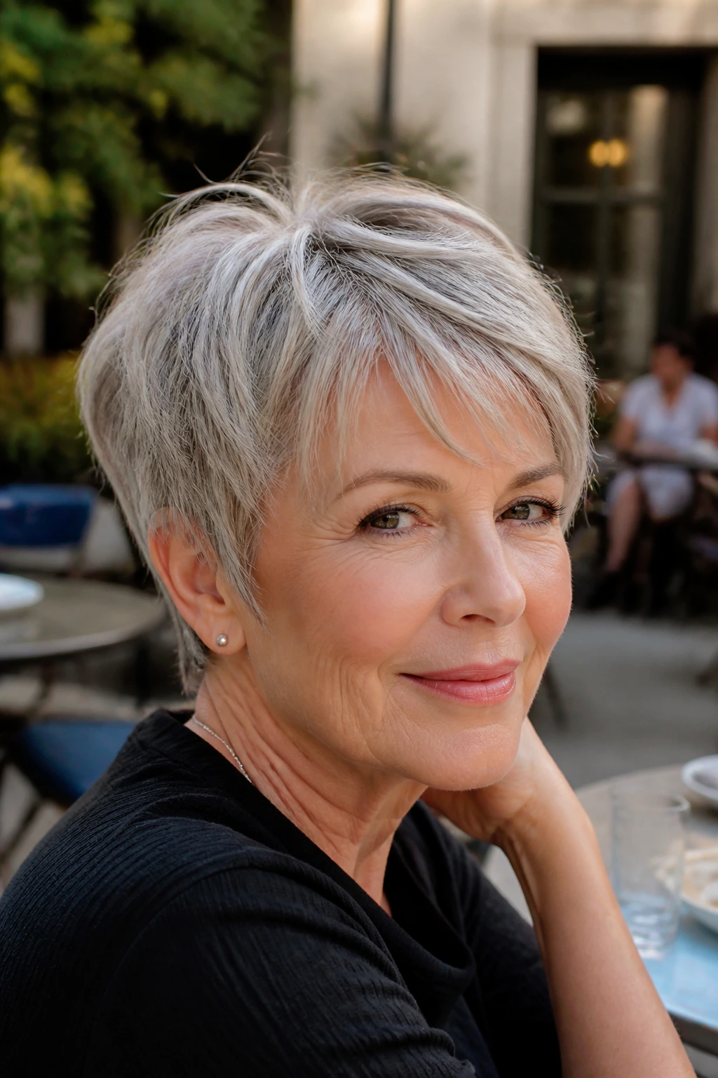 Close-up of a woman with a textured crop bob showing light layers and movement