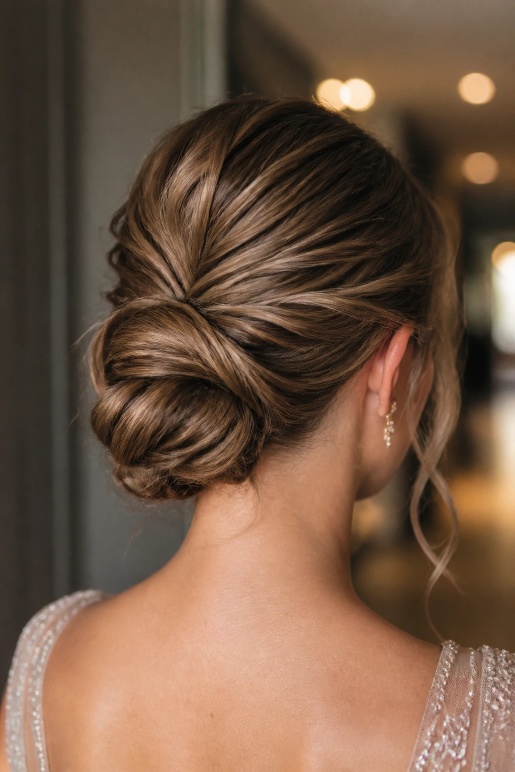 Back view of textured low chignon at the nape