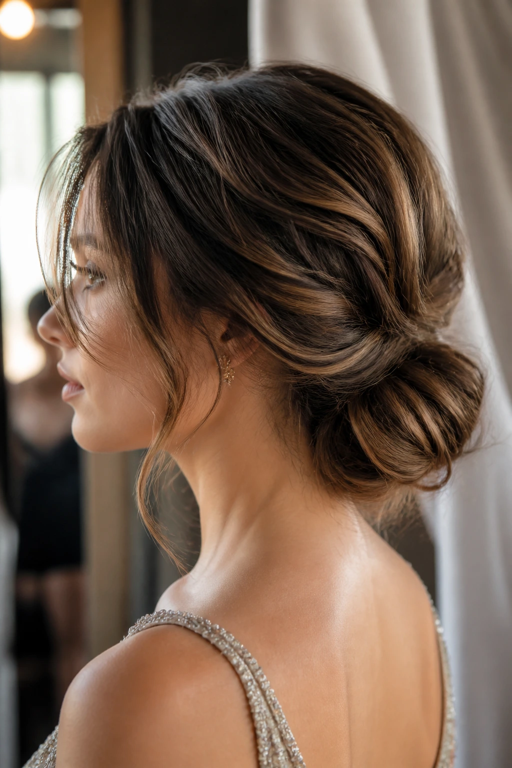 Close-up of a textured low knot hairstyle on a real woman