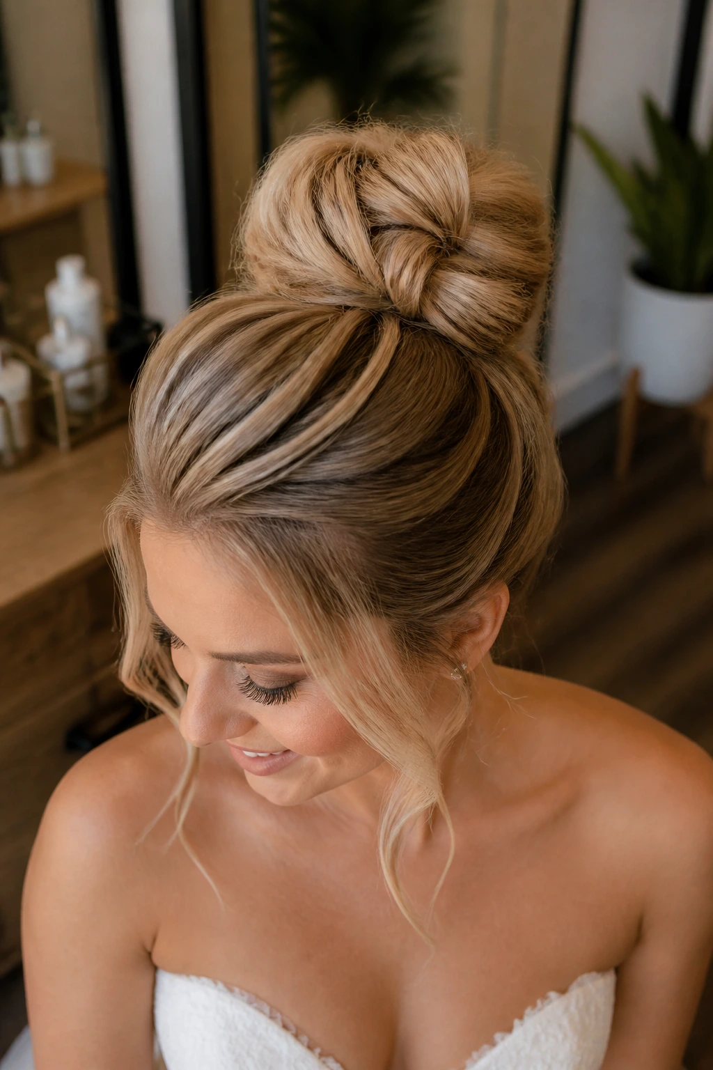 Close-up of a real bride wearing a textured top knot with invisible volume