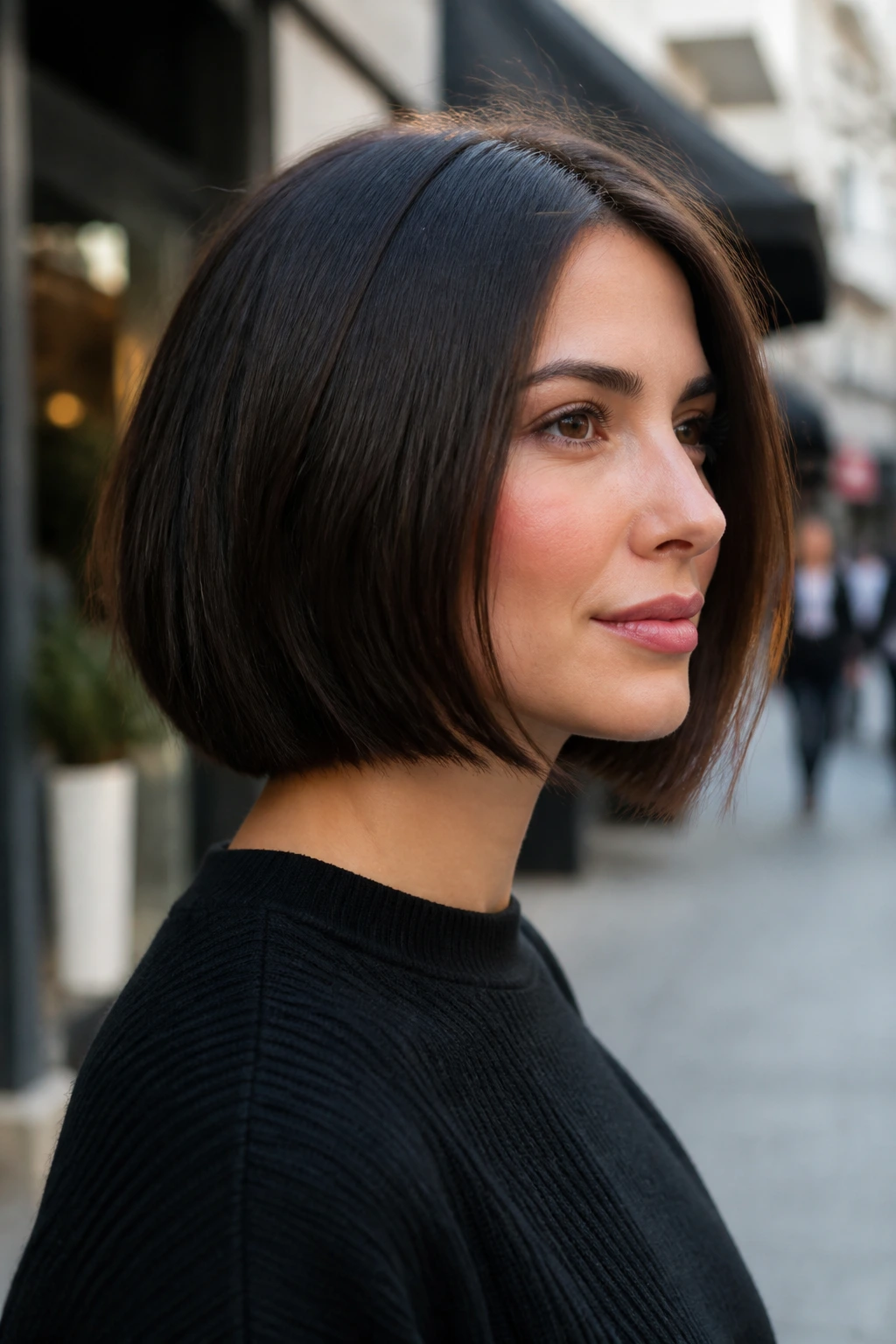 Portrait of a real woman with a thick-hair bob showing bulk-removal layers