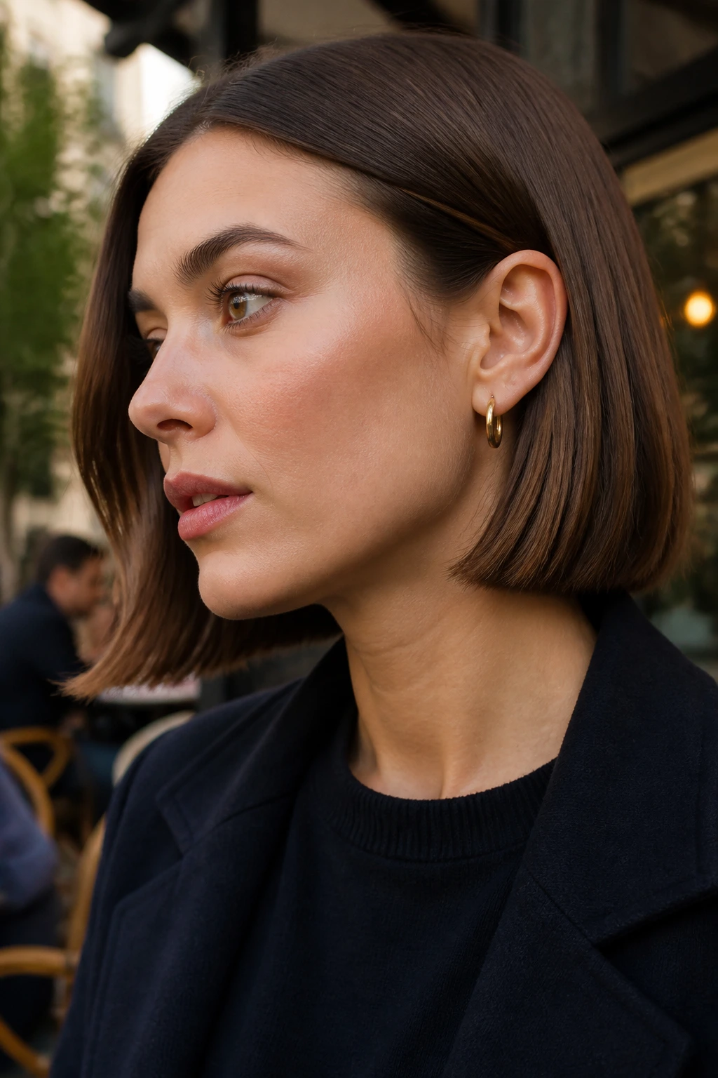 Portrait of a real woman with a tucked-behind-ear blunt bob