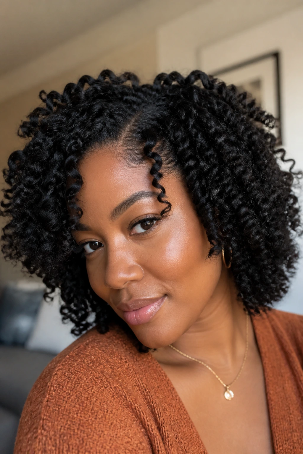 Close-up of a real person with a defined twist-out on medium-length hair