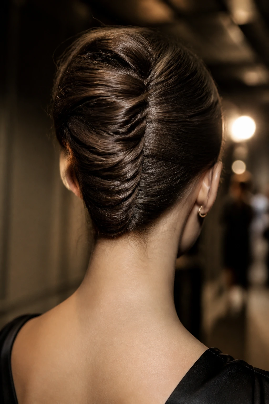 Close-up of a woman wearing a twisted French twist.