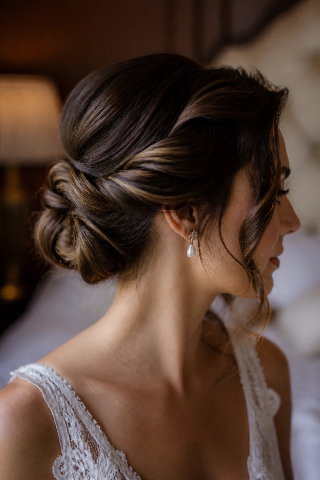 Close-up of a real bride with a twisted Gibson knot and soft tendrils around the face