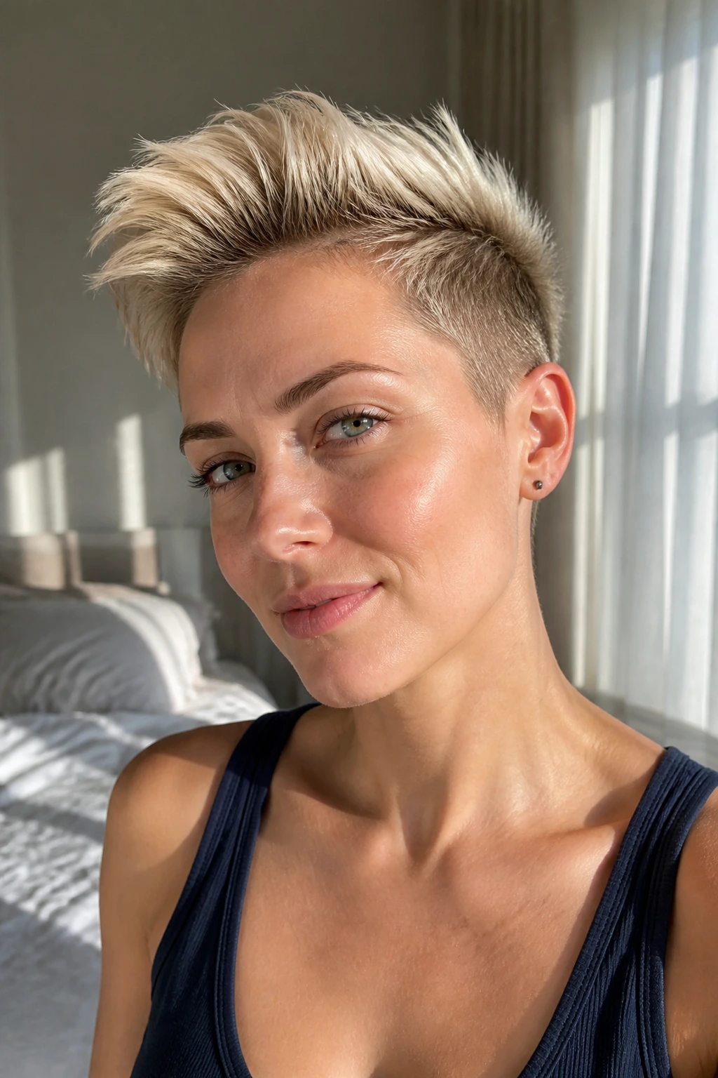 Close-up of a real woman with sunlit blonde undercut pixie under natural window light