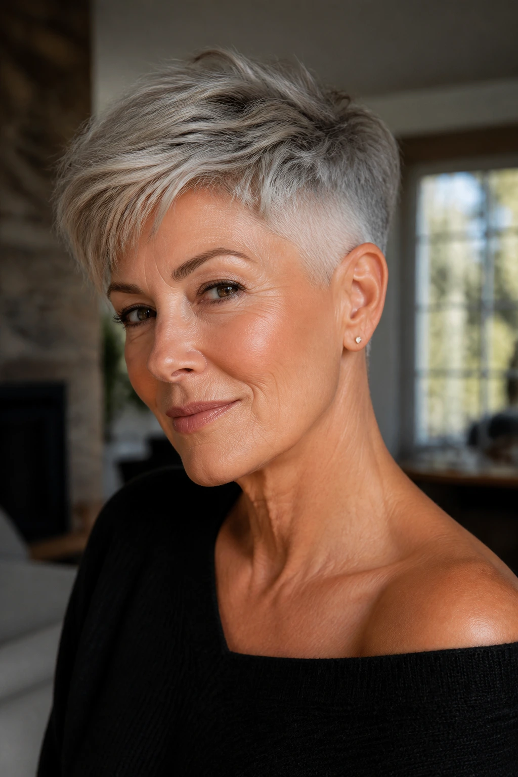 Close-up portrait of a real person with an undercut pixie, sides shaved and top long