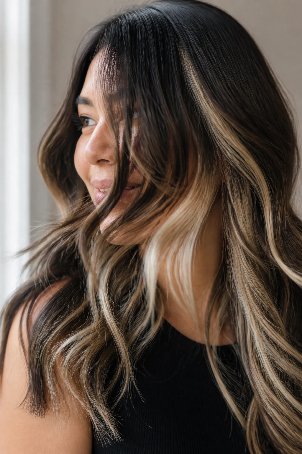 Close-up of a real woman revealing vanilla cream peekaboo underlayers