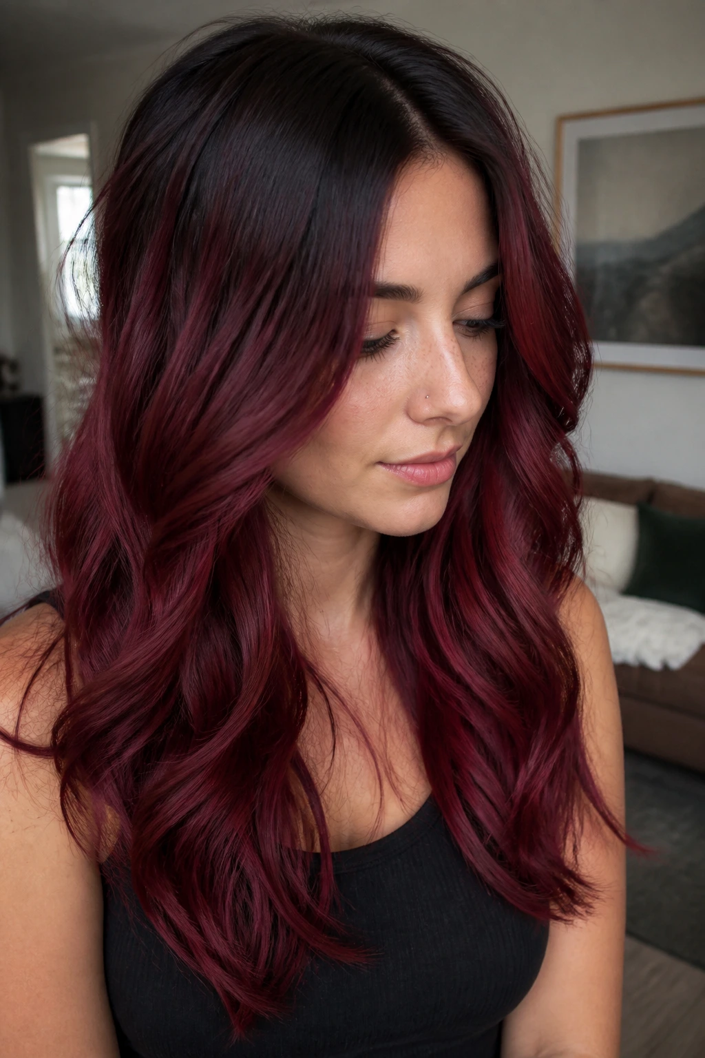 Root-melt burgundy hair transitioning from dark roots to wine-red ends