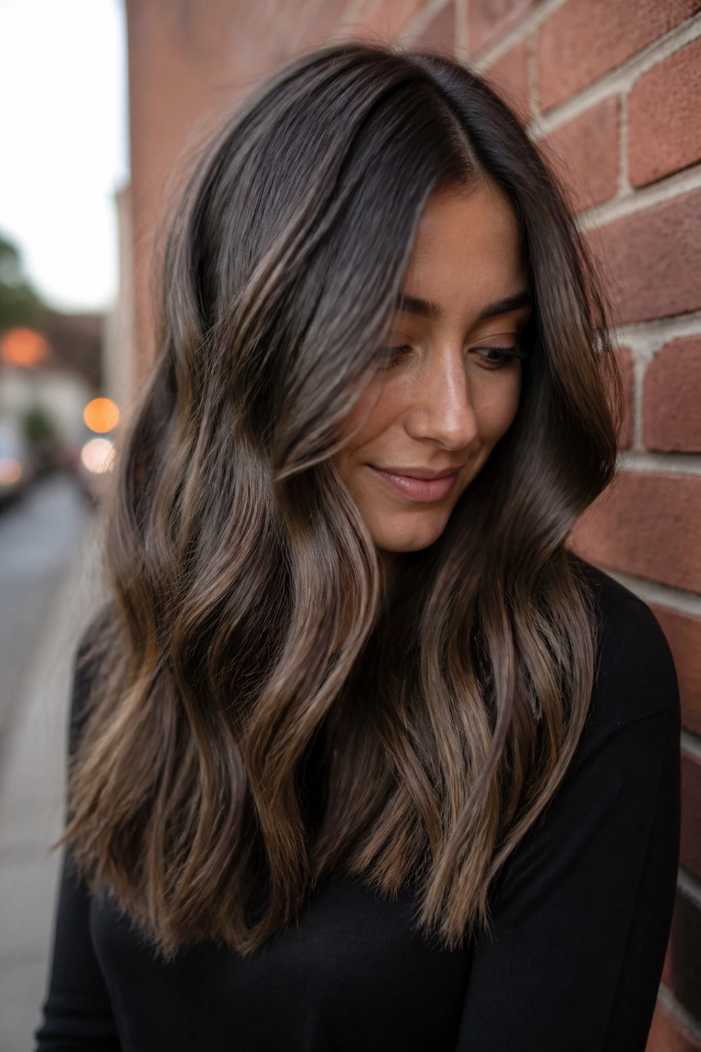 Close-up portrait of a real woman with Walnut Smoke balayage