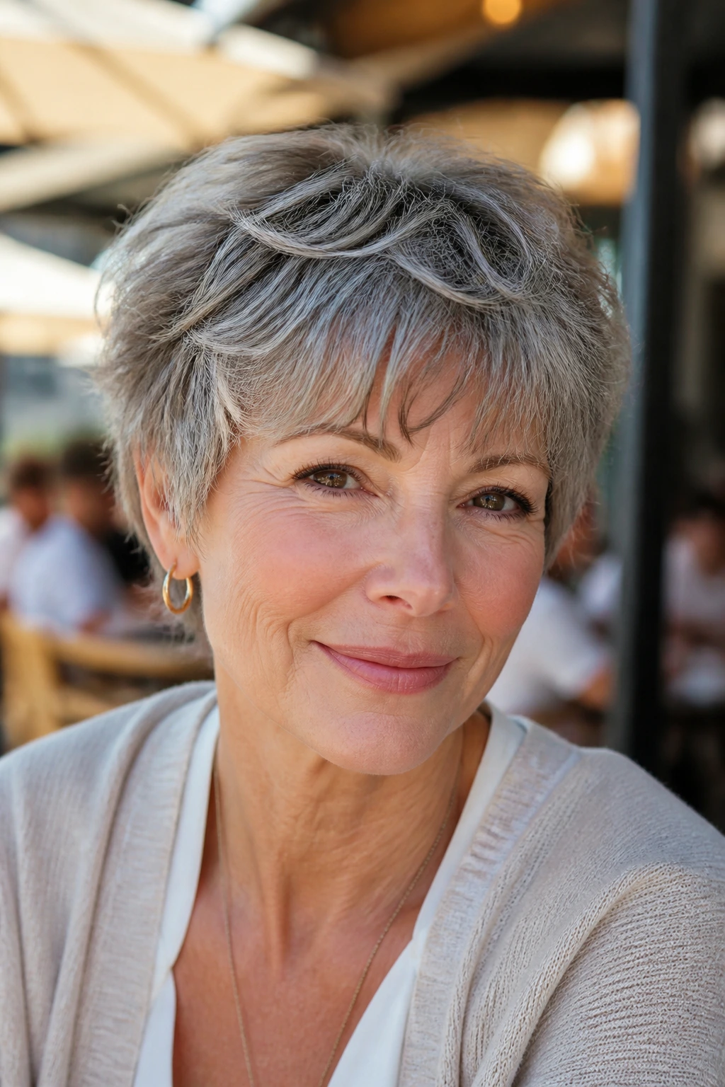 Real woman with wavy crop and brow-skimming fringe in sunlight