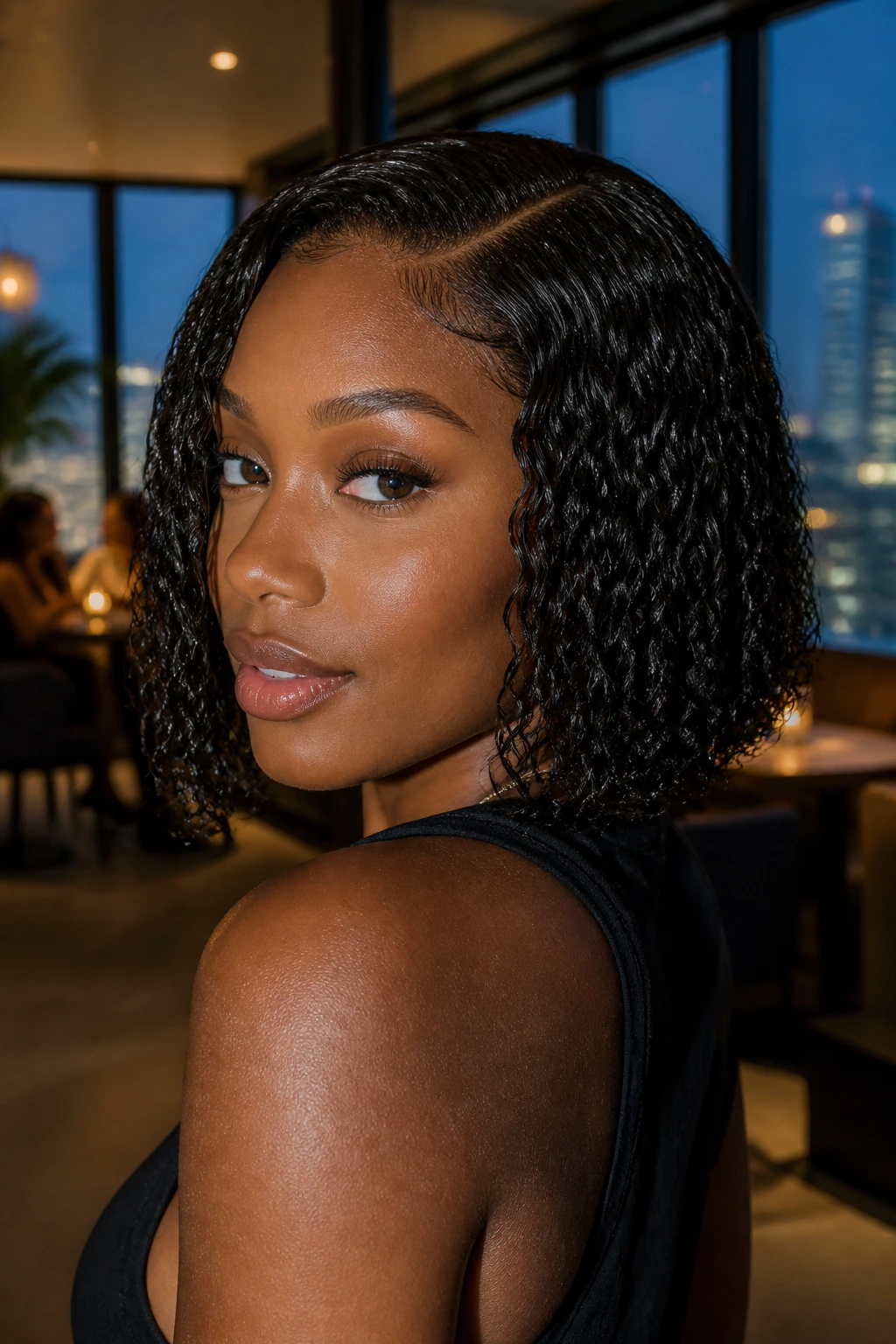 Portrait of a woman with a wet-look curl bob