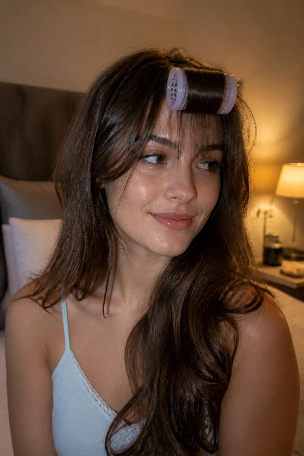 Nighttime portrait of wispy bangs pinned for a fresh look