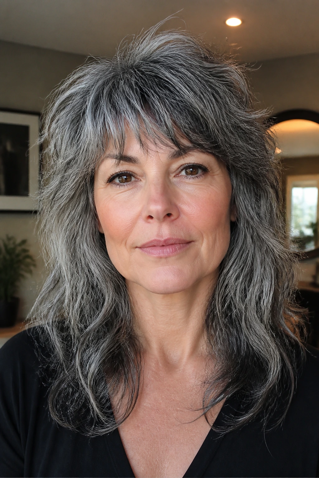 Portrait of woman with salt-and-pepper wolf cut