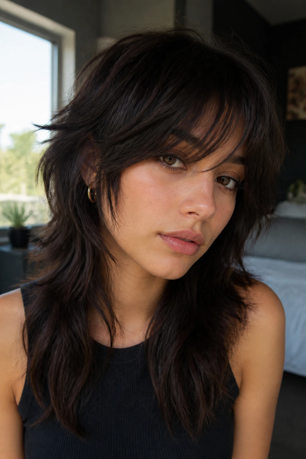 Close-up of a person with wolf cut and side bangs